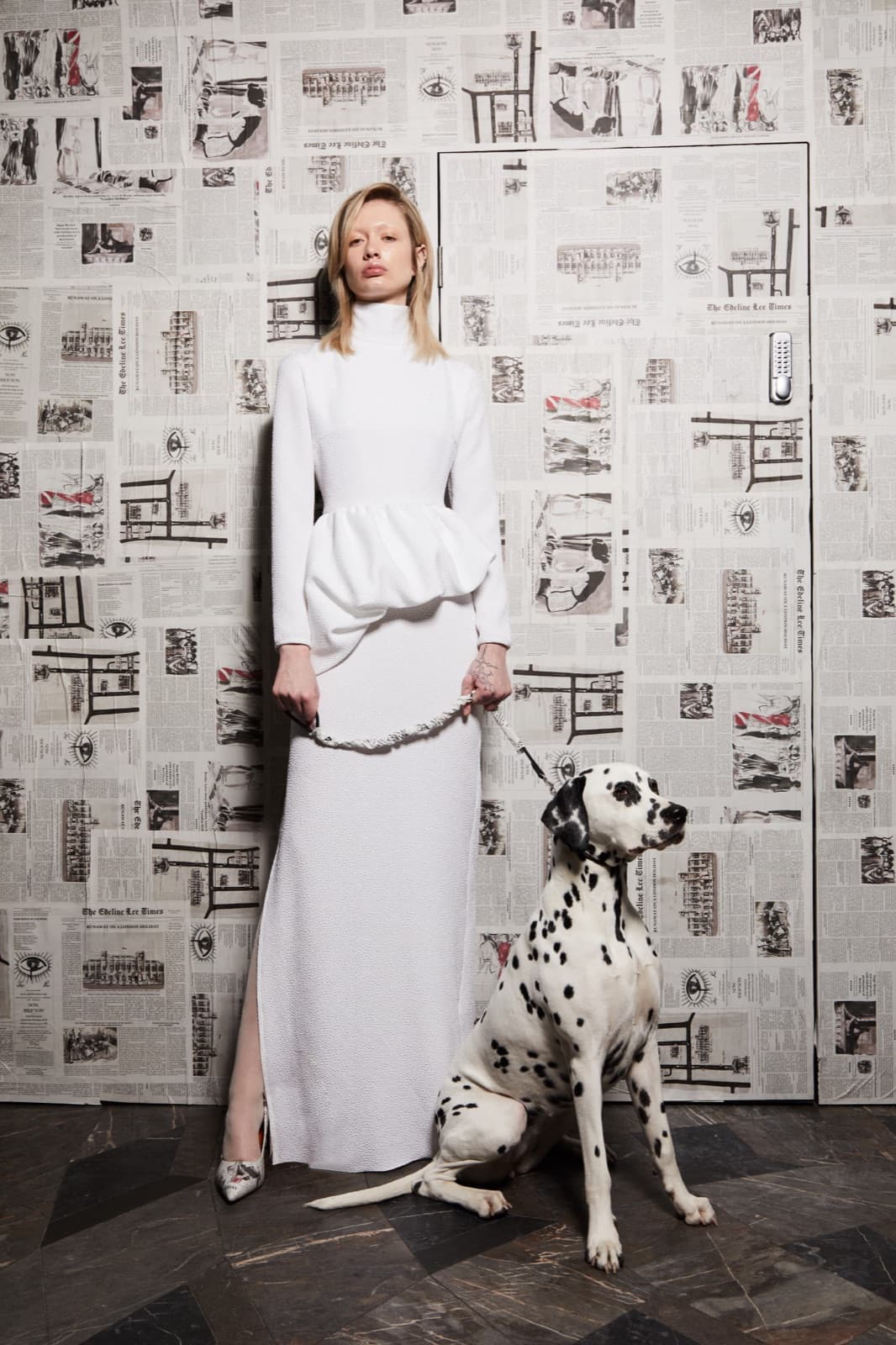 Sleek blonde chignon against a white column gown.
