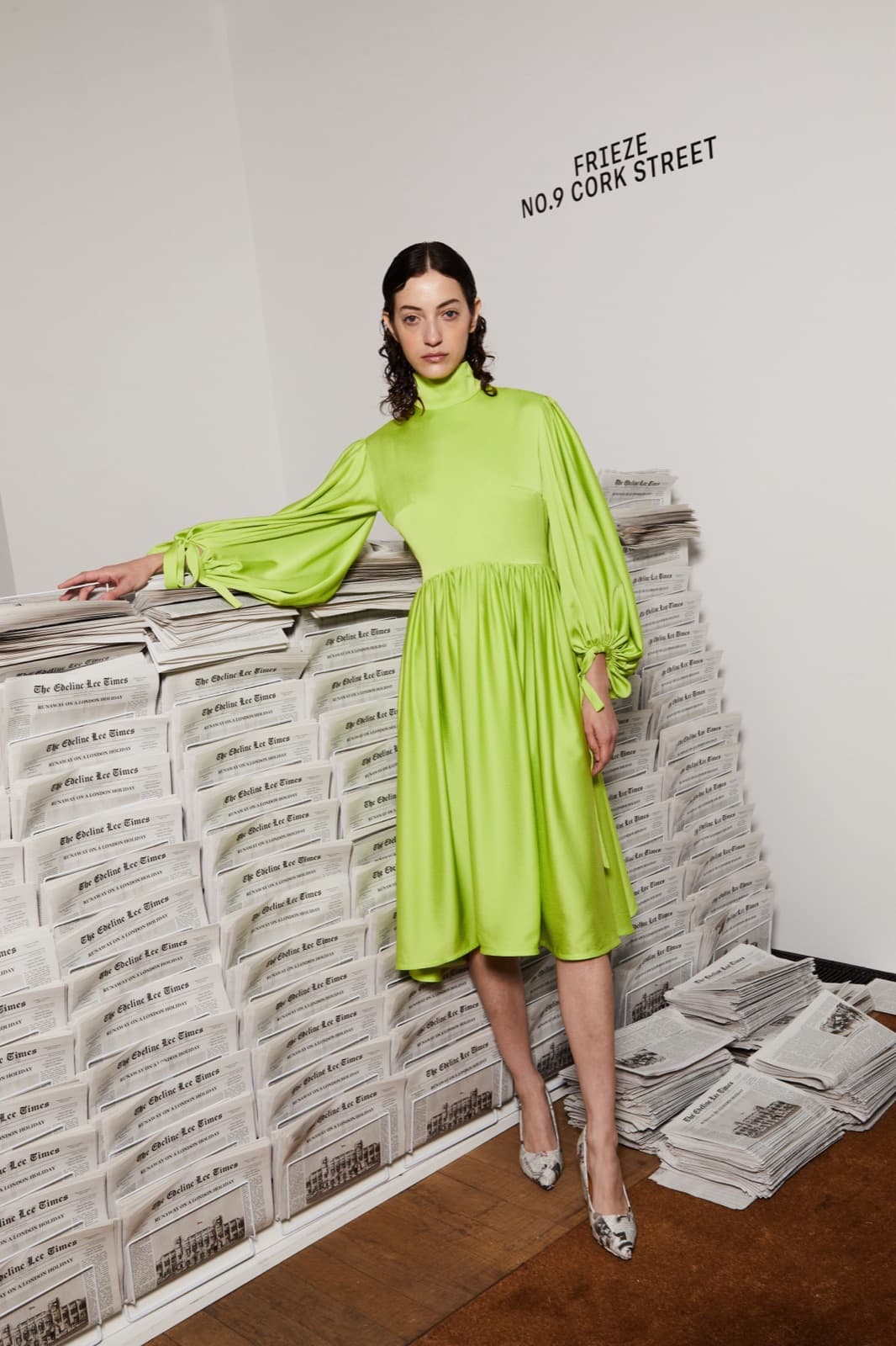 Dark centre-parted waves with a chartreuse dress.